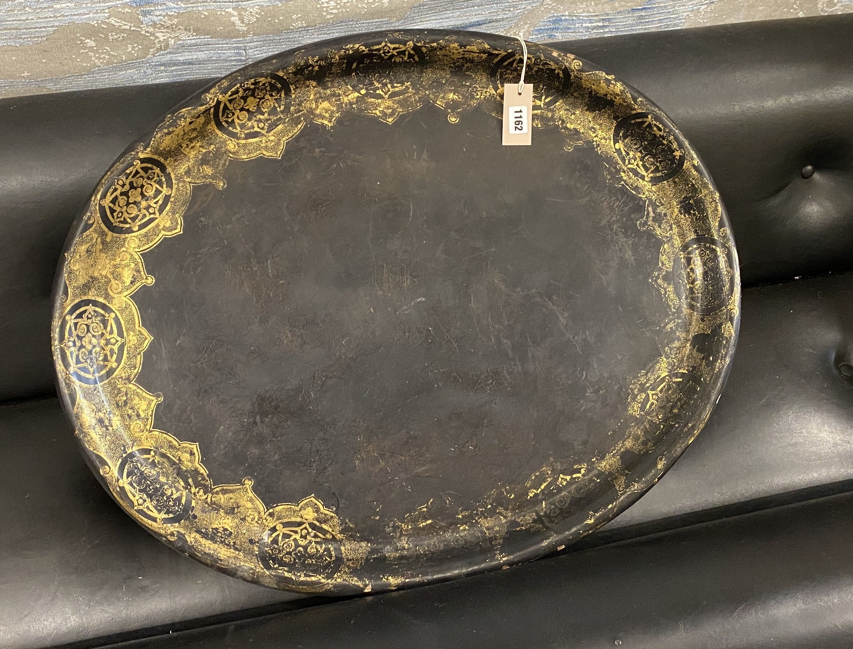 A Victorian oval gilt decorated black lacquered papier-mache tray, by Mechi, length 79cm, width 62cm
